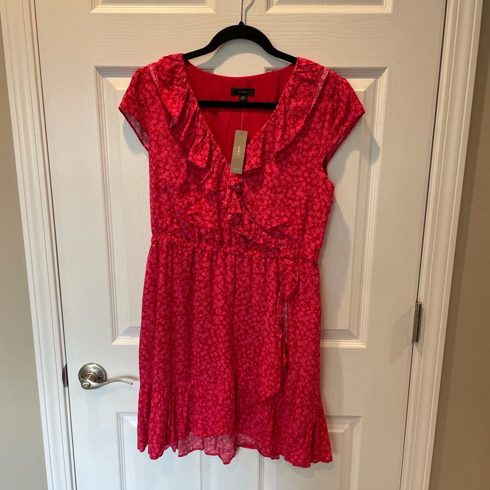 J. Crew red and pink floral dress with ruffles around bottom and neck area.